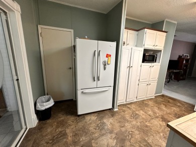 This home not only has 3 bedrooms and 2 bathrooms but a closed on Whisperwood Golf Course in Florida - for sale on GolfHomes.com, golf home, golf lot