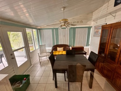 This home not only has 3 bedrooms and 2 bathrooms but a closed on Whisperwood Golf Course in Florida - for sale on GolfHomes.com, golf home, golf lot