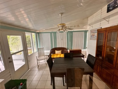 This home not only has 3 bedrooms and 2 bathrooms but a closed on Whisperwood Golf Course in Florida - for sale on GolfHomes.com, golf home, golf lot