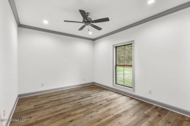 Welcome to this beautiful 4 bedroom, 2.5 bath home located in on Lake Caroline Golf Club in Mississippi - for sale on GolfHomes.com, golf home, golf lot
