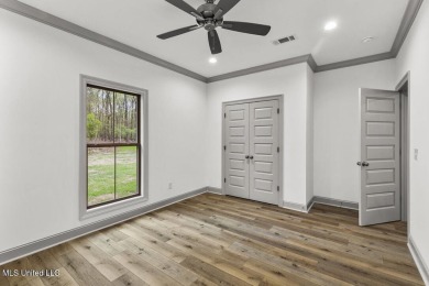 Welcome to this beautiful 4 bedroom, 2.5 bath home located in on Lake Caroline Golf Club in Mississippi - for sale on GolfHomes.com, golf home, golf lot