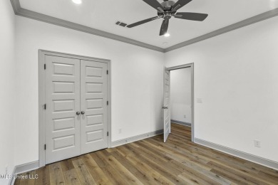 Welcome to this beautiful 4 bedroom, 2.5 bath home located in on Lake Caroline Golf Club in Mississippi - for sale on GolfHomes.com, golf home, golf lot