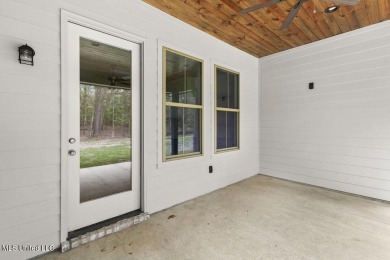 Welcome to this beautiful 4 bedroom, 2.5 bath home located in on Lake Caroline Golf Club in Mississippi - for sale on GolfHomes.com, golf home, golf lot
