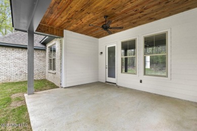 Welcome to this beautiful 4 bedroom, 2.5 bath home located in on Lake Caroline Golf Club in Mississippi - for sale on GolfHomes.com, golf home, golf lot