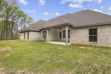 Welcome to this beautiful 4 bedroom, 2.5 bath home located in on Lake Caroline Golf Club in Mississippi - for sale on GolfHomes.com, golf home, golf lot