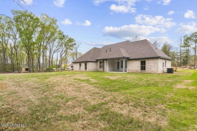 Welcome to this beautiful 4 bedroom, 2.5 bath home located in on Lake Caroline Golf Club in Mississippi - for sale on GolfHomes.com, golf home, golf lot