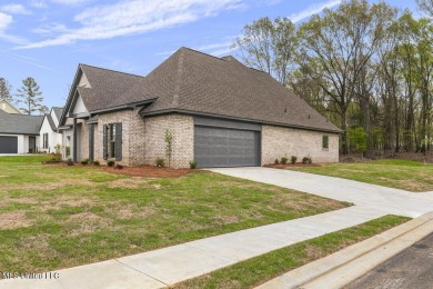 Welcome to this beautiful 4 bedroom, 2.5 bath home located in on Lake Caroline Golf Club in Mississippi - for sale on GolfHomes.com, golf home, golf lot