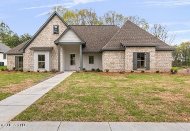 Welcome to this beautiful 4 bedroom, 2.5 bath home located in on Lake Caroline Golf Club in Mississippi - for sale on GolfHomes.com, golf home, golf lot