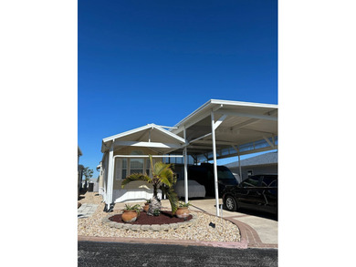 Furnished Park Model with large addition, double RV port, 2 on Deer Creek RV Golf Resort in Florida - for sale on GolfHomes.com, golf home, golf lot