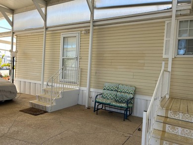 Furnished Park Model with large addition, double RV port, 2 on Deer Creek RV Golf Resort in Florida - for sale on GolfHomes.com, golf home, golf lot