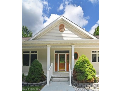 Step inside and discover a thoughtfully designed split ranch on Lost Lake Woods Club in Michigan - for sale on GolfHomes.com, golf home, golf lot