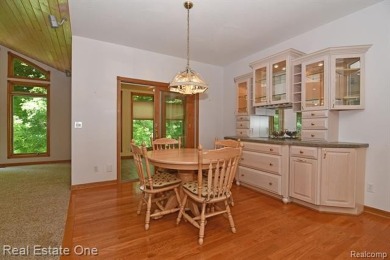 Step inside and discover a thoughtfully designed split ranch on Lost Lake Woods Club in Michigan - for sale on GolfHomes.com, golf home, golf lot