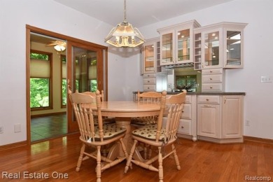Step inside and discover a thoughtfully designed split ranch on Lost Lake Woods Club in Michigan - for sale on GolfHomes.com, golf home, golf lot