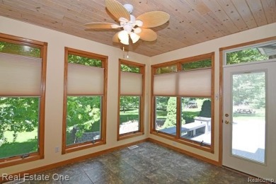 Step inside and discover a thoughtfully designed split ranch on Lost Lake Woods Club in Michigan - for sale on GolfHomes.com, golf home, golf lot