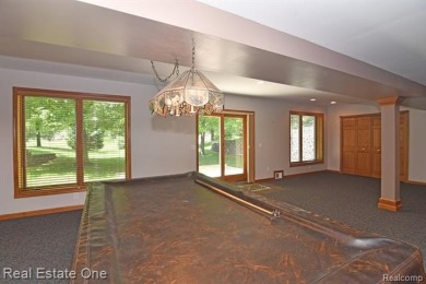 Step inside and discover a thoughtfully designed split ranch on Lost Lake Woods Club in Michigan - for sale on GolfHomes.com, golf home, golf lot