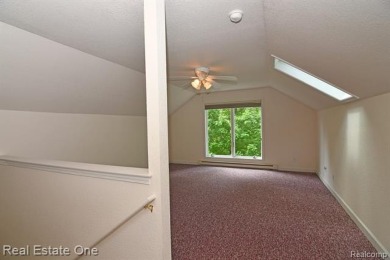 Step inside and discover a thoughtfully designed split ranch on Lost Lake Woods Club in Michigan - for sale on GolfHomes.com, golf home, golf lot