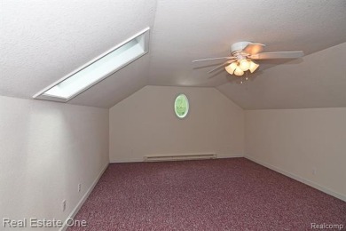 Step inside and discover a thoughtfully designed split ranch on Lost Lake Woods Club in Michigan - for sale on GolfHomes.com, golf home, golf lot