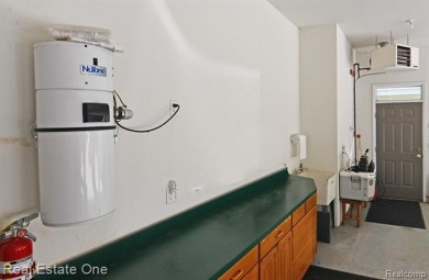 Step inside and discover a thoughtfully designed split ranch on Lost Lake Woods Club in Michigan - for sale on GolfHomes.com, golf home, golf lot