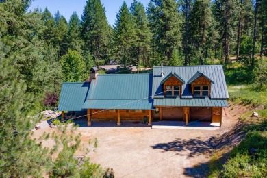 Introducing a one-of-a-kind hand-hewn log cabin nestled in the on Terrace Lakes Golf Resort in Idaho - for sale on GolfHomes.com, golf home, golf lot