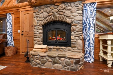 Introducing a one-of-a-kind hand-hewn log cabin nestled in the on Terrace Lakes Golf Resort in Idaho - for sale on GolfHomes.com, golf home, golf lot