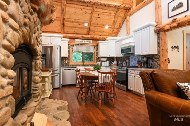 Introducing a one-of-a-kind hand-hewn log cabin nestled in the on Terrace Lakes Golf Resort in Idaho - for sale on GolfHomes.com, golf home, golf lot