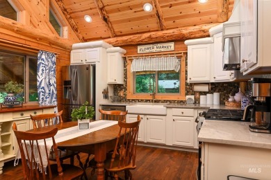 Introducing a one-of-a-kind hand-hewn log cabin nestled in the on Terrace Lakes Golf Resort in Idaho - for sale on GolfHomes.com, golf home, golf lot