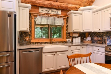 Introducing a one-of-a-kind hand-hewn log cabin nestled in the on Terrace Lakes Golf Resort in Idaho - for sale on GolfHomes.com, golf home, golf lot