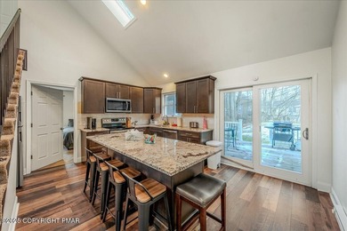 Do not miss this turnkey, fully furnished, and STR-ready in on Pocono Farms Country Club in Pennsylvania - for sale on GolfHomes.com, golf home, golf lot