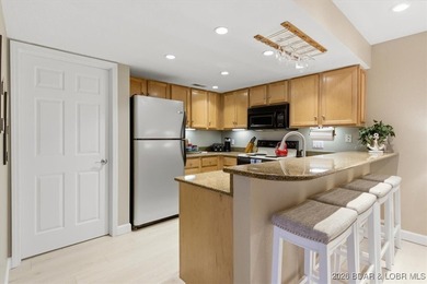 Escape to 488 Regatta Bay Circle #1A, a stylish 2-bedroom + on Seasons Ridge At Four Seasons in Missouri - for sale on GolfHomes.com, golf home, golf lot