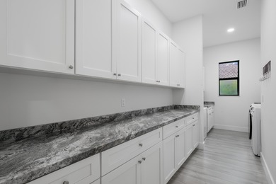 Elegant newer-construction pool home in gated Country Club on St. Lucie Trail Golf Club in Florida - for sale on GolfHomes.com, golf home, golf lot