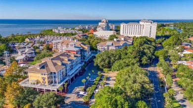 Escape to coastal luxury in this exquisite two-bedroom two-bath on Sandestin Golf and Beach Resort - Raven in Florida - for sale on GolfHomes.com, golf home, golf lot