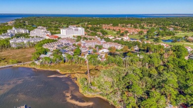 Escape to coastal luxury in this exquisite two-bedroom two-bath on Sandestin Golf and Beach Resort - Raven in Florida - for sale on GolfHomes.com, golf home, golf lot