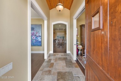Nestled in a serene setting with views of a pond and golf course on Bay Point Resort Golf Club in Florida - for sale on GolfHomes.com, golf home, golf lot