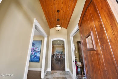 Nestled in a serene setting with views of a pond and golf course on Bay Point Resort Golf Club in Florida - for sale on GolfHomes.com, golf home, golf lot