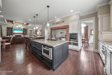 Nestled in a serene setting with views of a pond and golf course on Bay Point Resort Golf Club in Florida - for sale on GolfHomes.com, golf home, golf lot