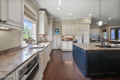 Nestled in a serene setting with views of a pond and golf course on Bay Point Resort Golf Club in Florida - for sale on GolfHomes.com, golf home, golf lot