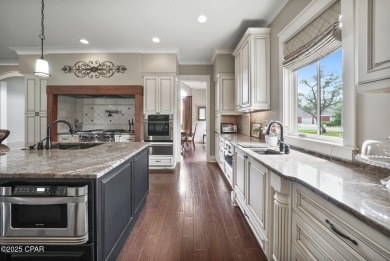 Nestled in a serene setting with views of a pond and golf course on Bay Point Resort Golf Club in Florida - for sale on GolfHomes.com, golf home, golf lot