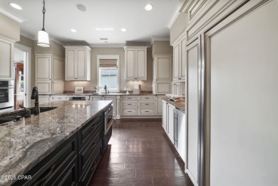 Nestled in a serene setting with views of a pond and golf course on Bay Point Resort Golf Club in Florida - for sale on GolfHomes.com, golf home, golf lot