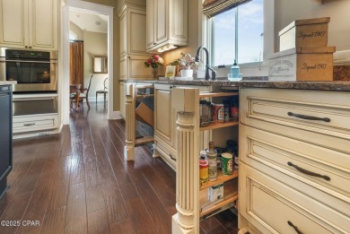 Nestled in a serene setting with views of a pond and golf course on Bay Point Resort Golf Club in Florida - for sale on GolfHomes.com, golf home, golf lot