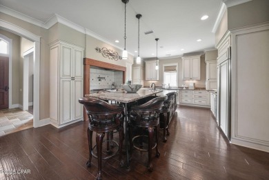 Nestled in a serene setting with views of a pond and golf course on Bay Point Resort Golf Club in Florida - for sale on GolfHomes.com, golf home, golf lot