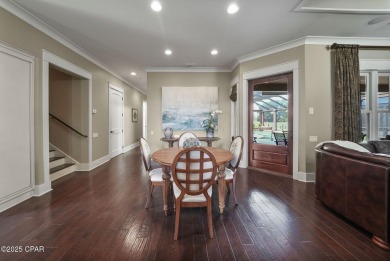 Nestled in a serene setting with views of a pond and golf course on Bay Point Resort Golf Club in Florida - for sale on GolfHomes.com, golf home, golf lot