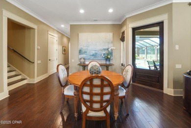Nestled in a serene setting with views of a pond and golf course on Bay Point Resort Golf Club in Florida - for sale on GolfHomes.com, golf home, golf lot