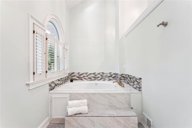 Tucked in Atlanta Country Clubs quiet interior, this refreshed on Atlanta Country Club in Georgia - for sale on GolfHomes.com, golf home, golf lot