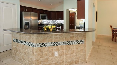 This gorgeous Lantana is located in the Village of Saint Charles on Glenview Championship Golf and Country Club in Florida - for sale on GolfHomes.com, golf home, golf lot