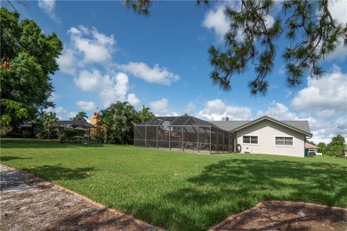 Tropical, lushly landscaped .27 acre lot with tranquil lagoon on Royal Palm Golf Club in Florida - for sale on GolfHomes.com, golf home, golf lot