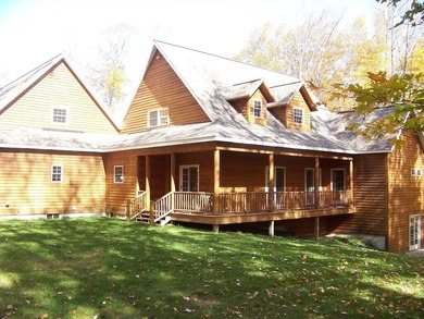 Welcome to this beautifully maintained Northern Michigan getaway on Michaywe Pines Course in Michigan - for sale on GolfHomes.com, golf home, golf lot