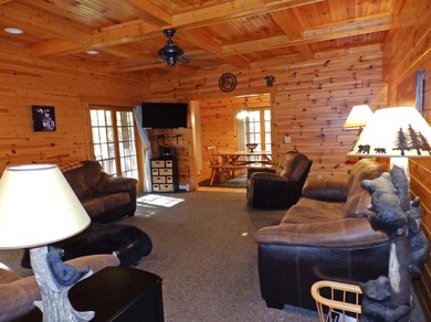Welcome to this beautifully maintained Northern Michigan getaway on Michaywe Pines Course in Michigan - for sale on GolfHomes.com, golf home, golf lot