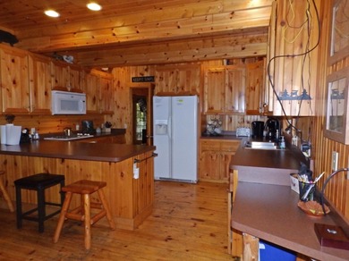 Welcome to this beautifully maintained Northern Michigan getaway on Michaywe Pines Course in Michigan - for sale on GolfHomes.com, golf home, golf lot