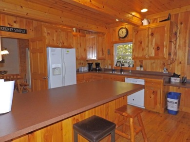 Welcome to this beautifully maintained Northern Michigan getaway on Michaywe Pines Course in Michigan - for sale on GolfHomes.com, golf home, golf lot