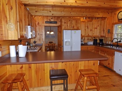 Welcome to this beautifully maintained Northern Michigan getaway on Michaywe Pines Course in Michigan - for sale on GolfHomes.com, golf home, golf lot